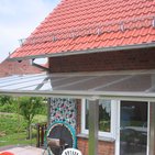 Glasüberdachung einer Terrasse mit Edelstahlständerwerk